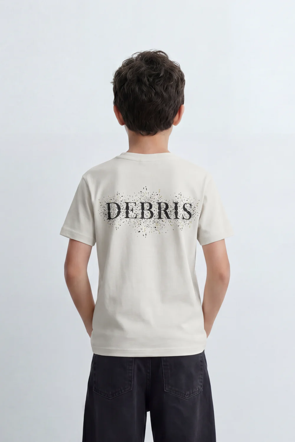 Boy's Tomato Store Debris Burst T-Shirt Made From Soft Cotton Knit Fabric Featuring Large Back Typography Print Distressed Speckle Splash Artwork - Image 6
