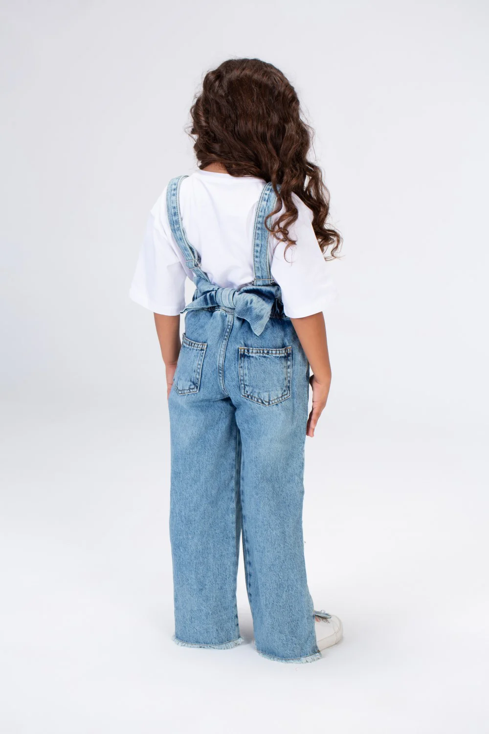 Girls Used Slouchy Jeans Jumpsuit With A Bow Tie At The Back And A Modern Cut - Image 3